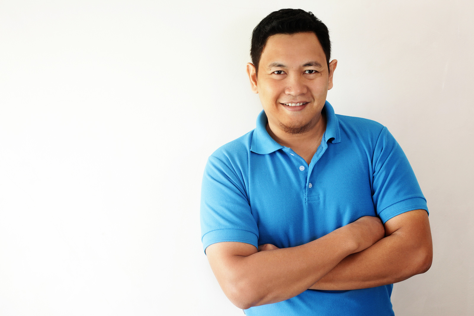 Young Asian Man Smiling Happily